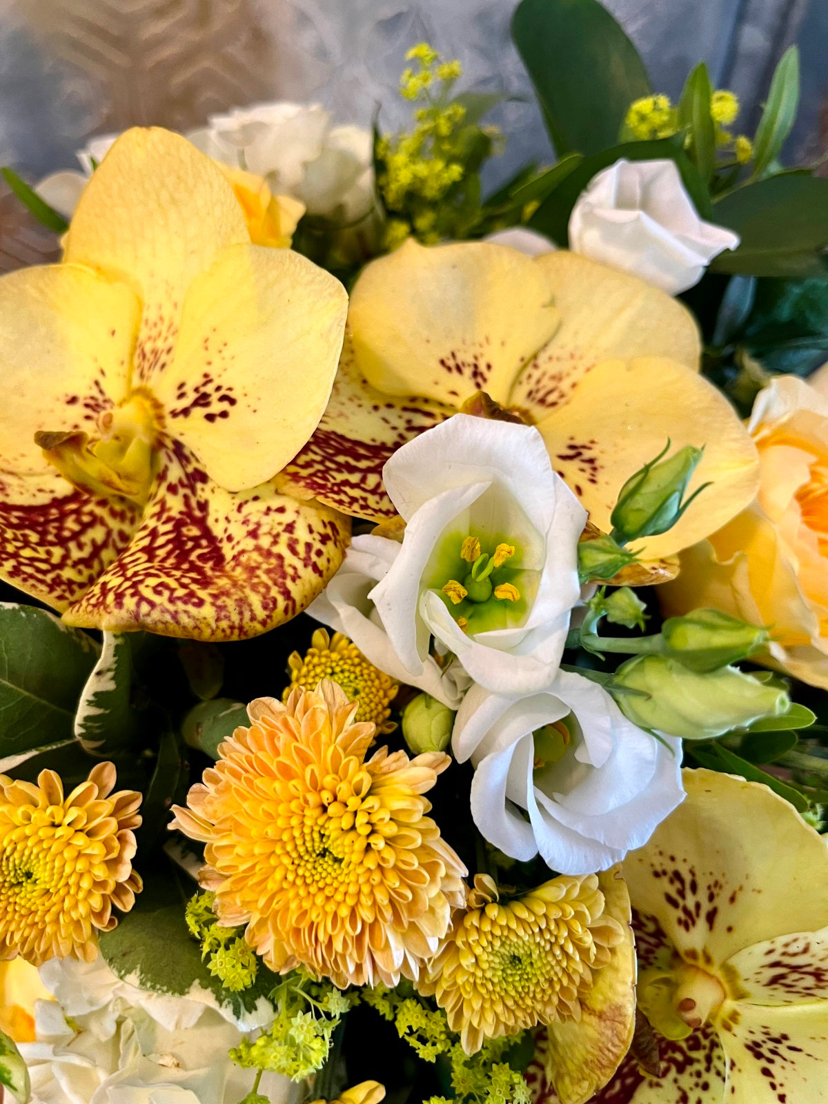 Flower Arrangement in shades of Yellows, Whites and Peaches Close up