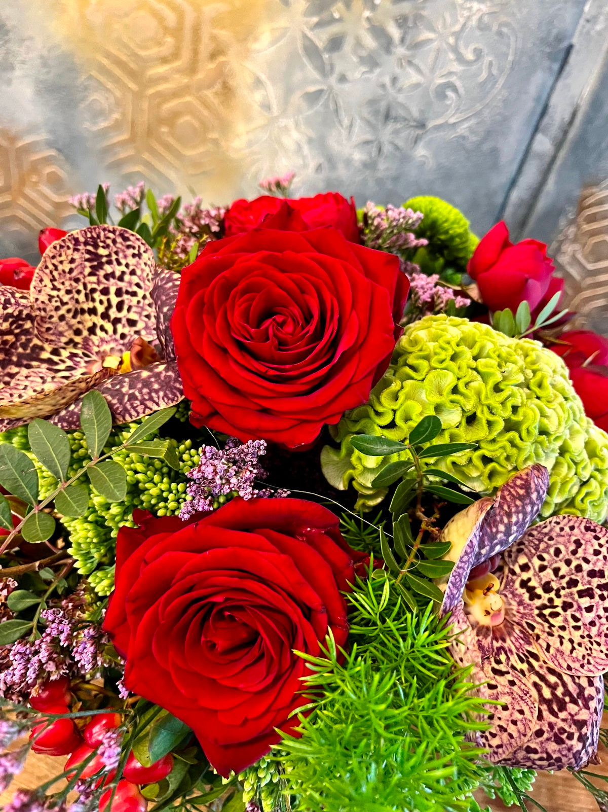 Orchids and Red Roses Flower Arrangement zoomed in image
