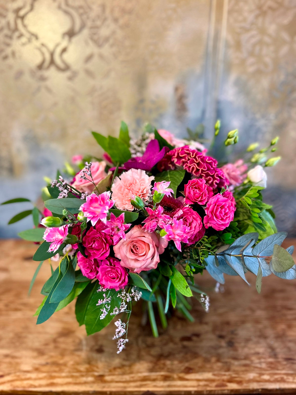 A pretty in pink hand tied flower bouquet in shades of pinks.