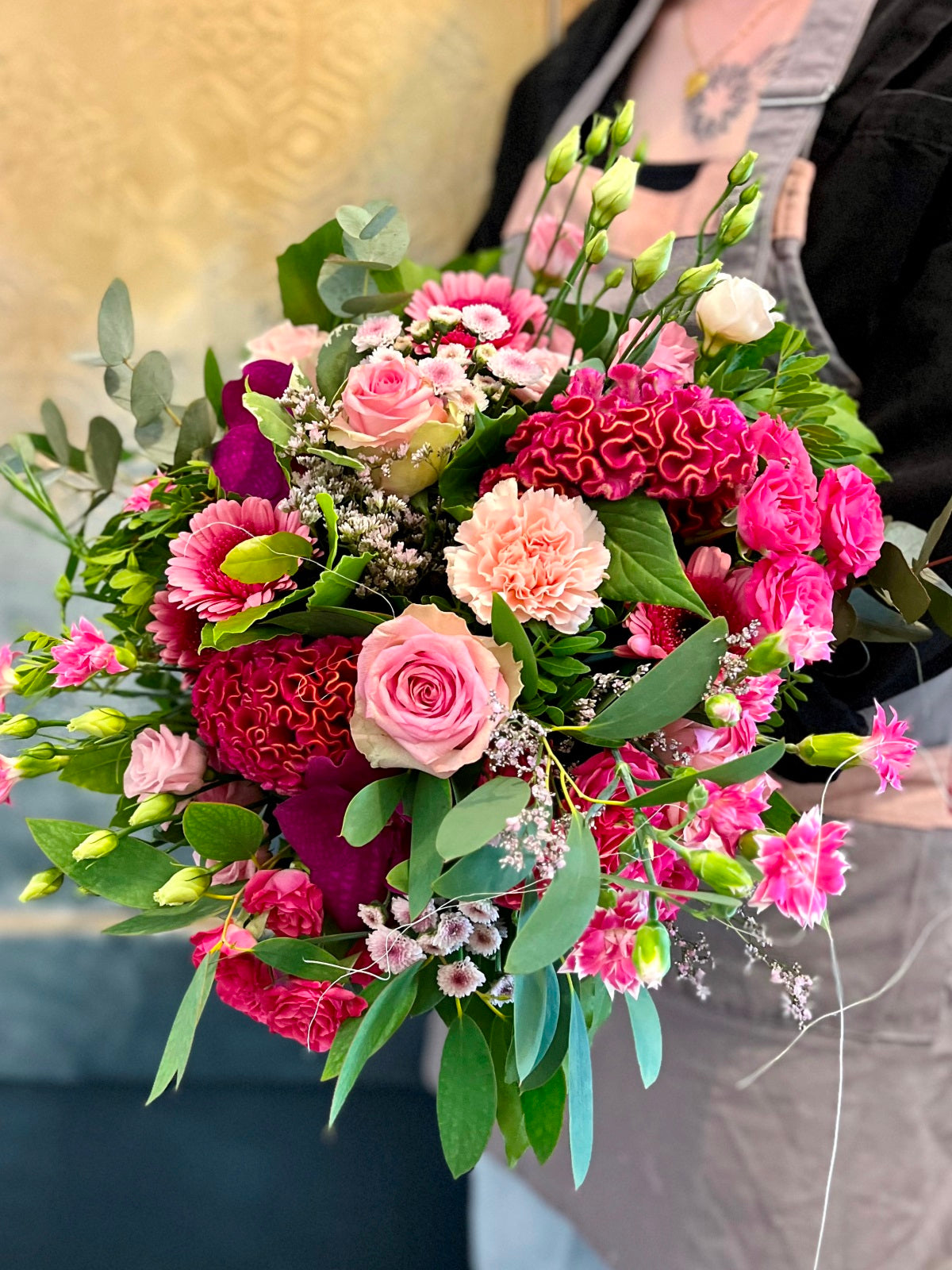 A pretty in pink hand tied flower bouquet in shades of pinks detail.