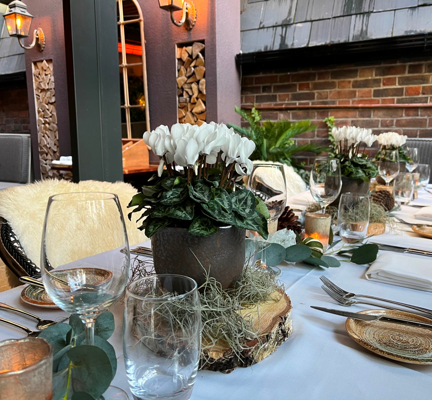 Beautiful small white flowers in ceramic bowls by Blooming Amazing Flower Company