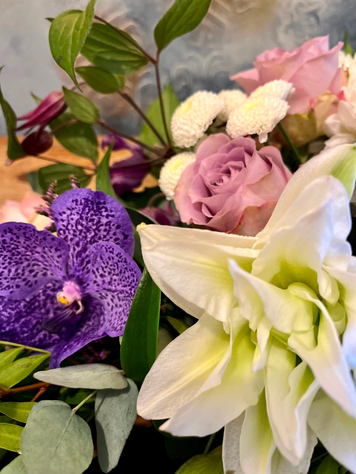 Funeral Spray in White and Purple zoomed in