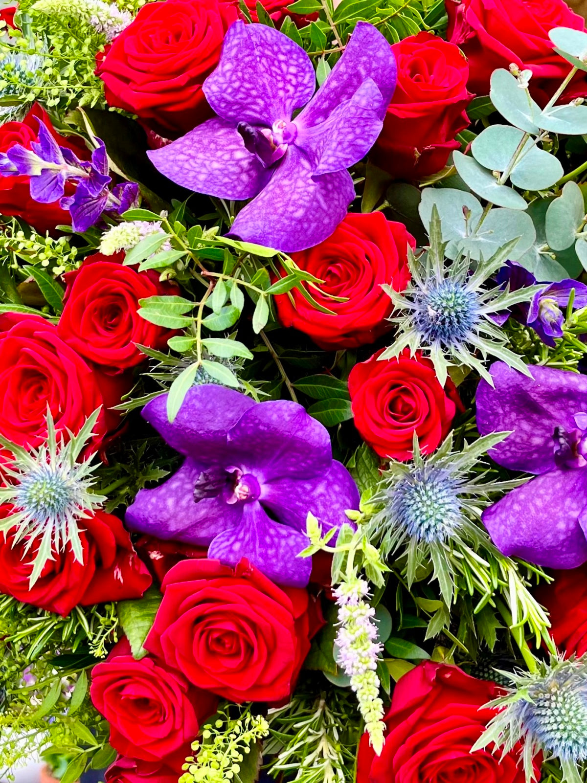 Luxury Orchids and Red Roses Bouquet zoomed in