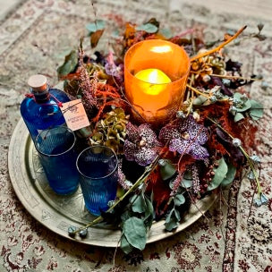 Special events flower arrangement with a bright candle