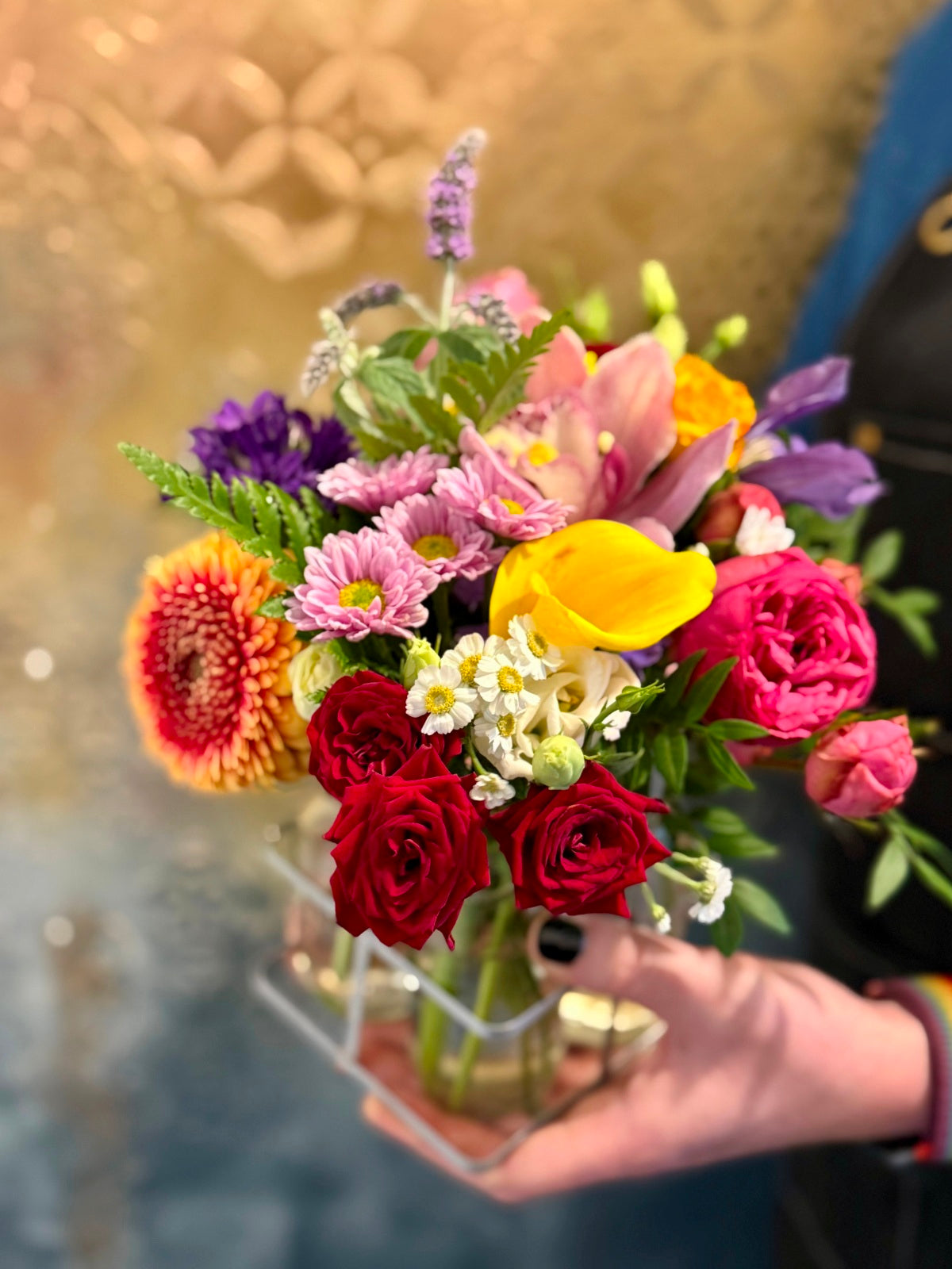 Blooms in Bottles. Petite flower arrangements in four mini milk bottle vases