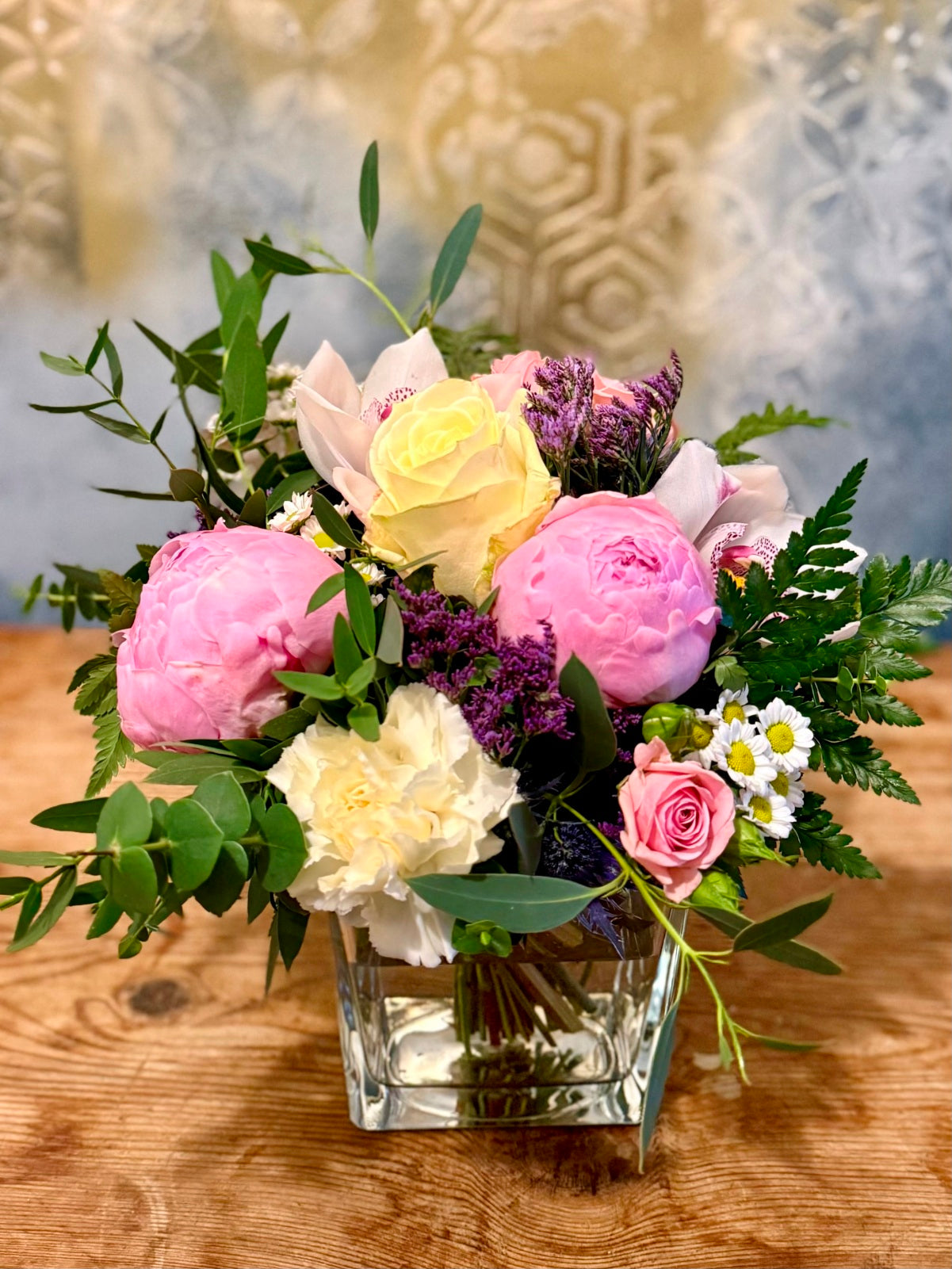 Peony roses flower aArrangement in cube vase