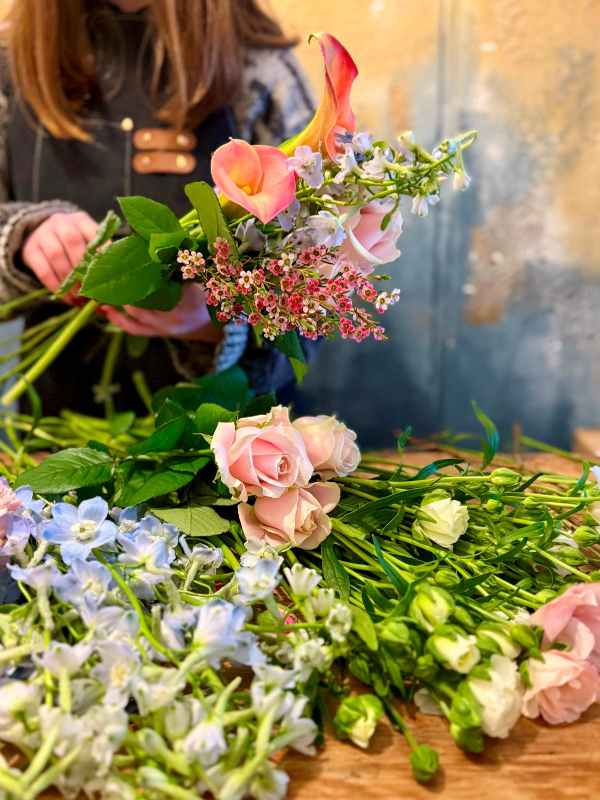 Catch of the day flower bouquet being arranged by our florist in flower shop