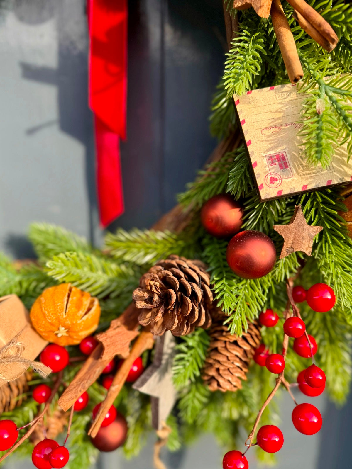Artificial Christmas Door Wreath in Festive Reds