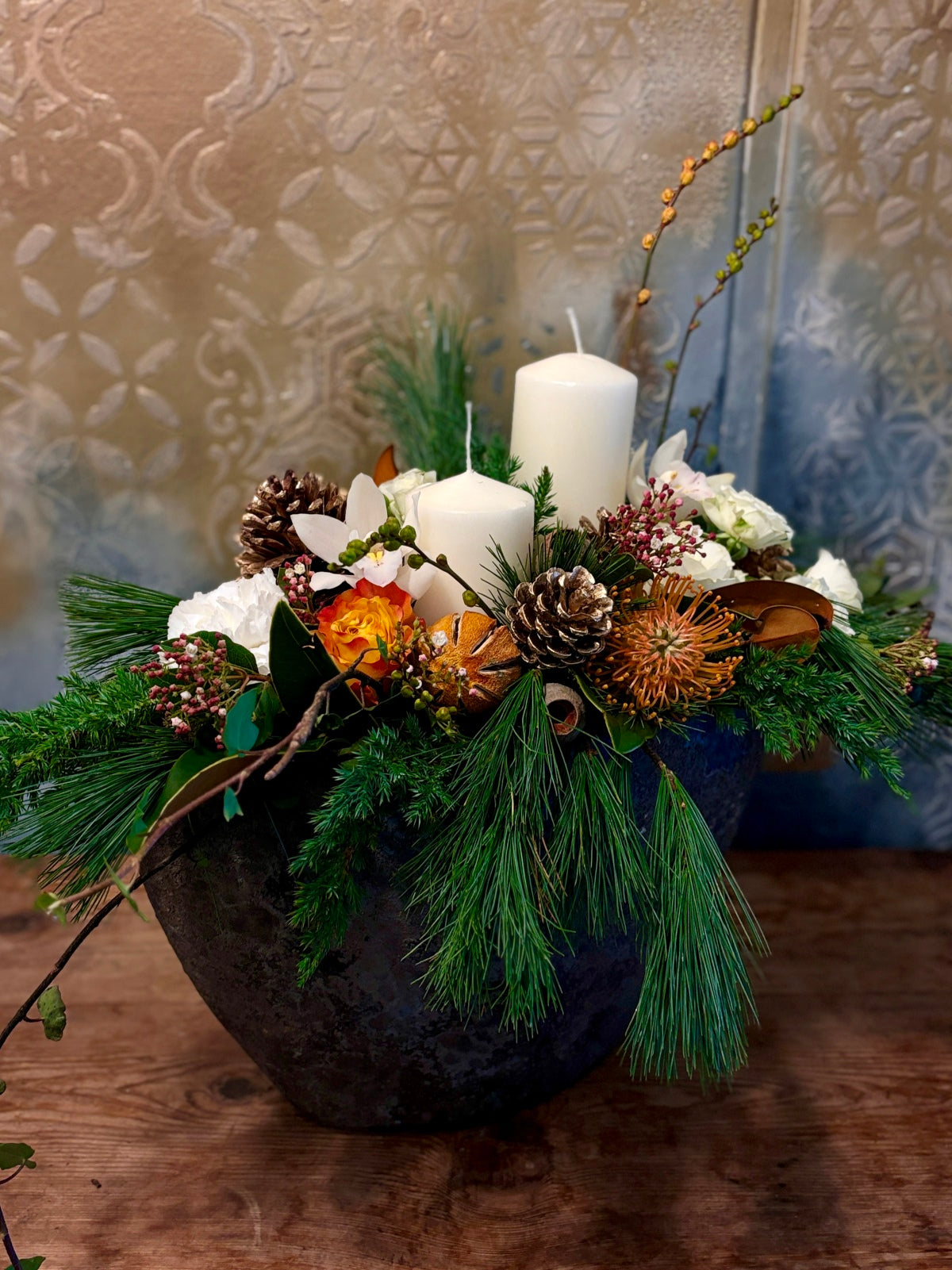 Large Christmas Candle and White Flower Arrangement in Urn