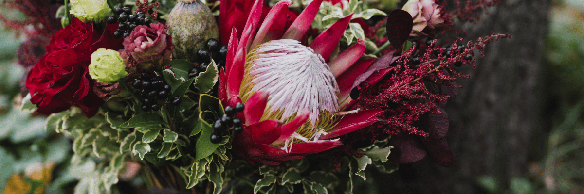 Elegant bridal bouquet in red and green flowers