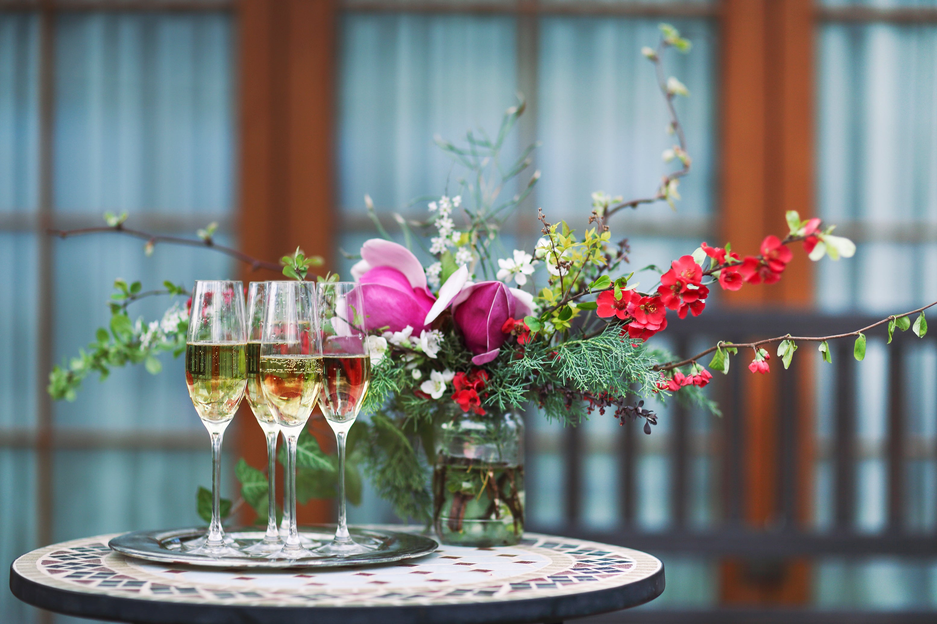 Small beautiful pink flower arrangement on a drinks table