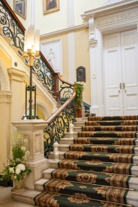 Number 6 Kildare St. Dublin sweeping staircase at Royal College of Physicians decorated with flowers and lanterns