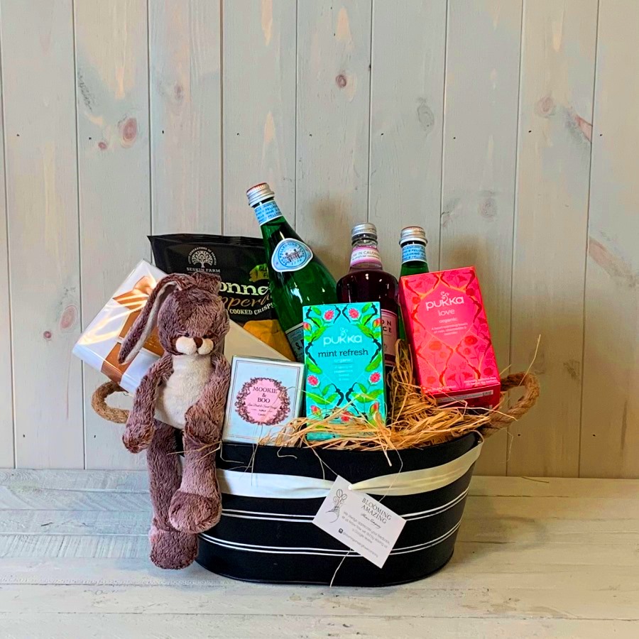 A gift hamper with treats for a new mum and her new baby