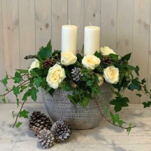 Christmas candle flower arrangement in whites for delivery in Dublin