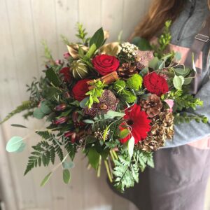 Christmas flower bouquet in reds - festive flowers for delivery in Dublin Ireland