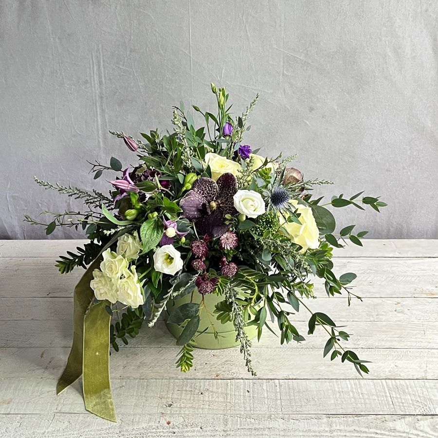 Gorgeous gifts for delivery in Dublin like this Freesia and Spring Roses arranged in a pretty hatbox