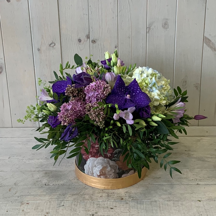 Flowers for corporate and home delivery in Dublin - blue summer flowers arranged in a pretty hatbox