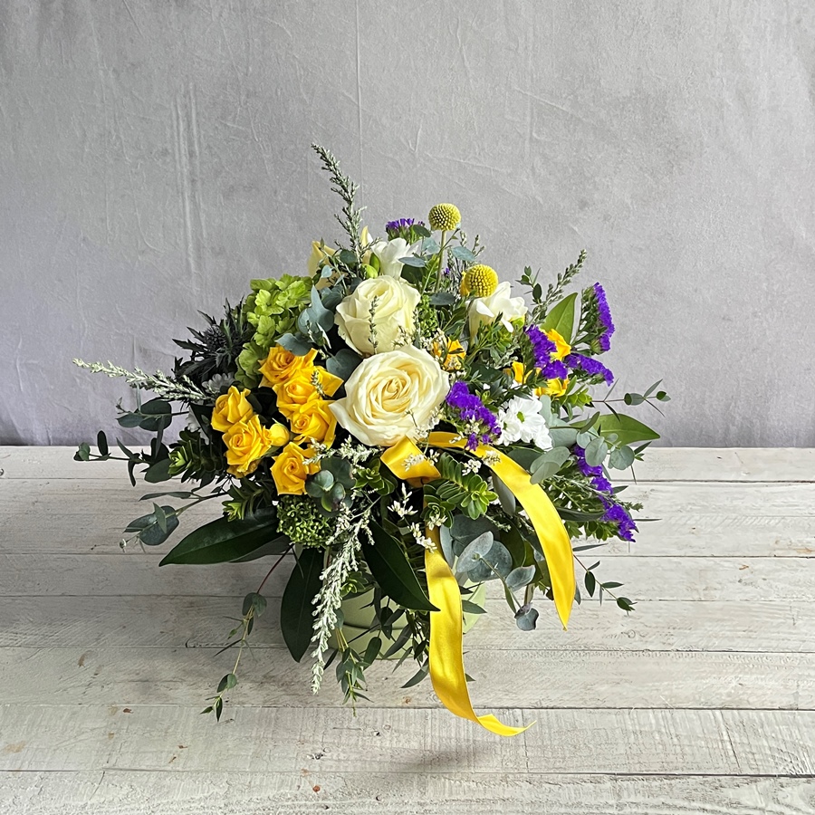 Scented spring flowers in hatbox. Hand crafted flowers and gifts for delivery in Dublin