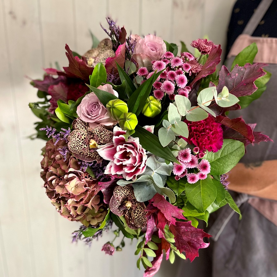 A wintyer flower bouquet in pink tones. Designed by our expert florists and delivered throughout Dublin from our flower shop in Ranelagh