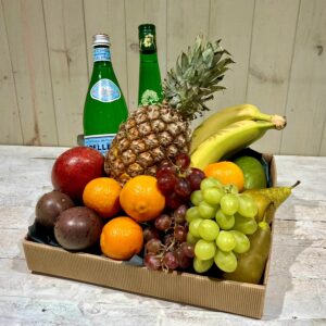 A selection of fresh fruit presented in a cardboard hamper available to order for delivery in Dublin