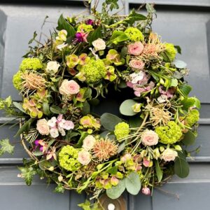 A spring door wreath designed in a natural wild style to celebrate the Spring season