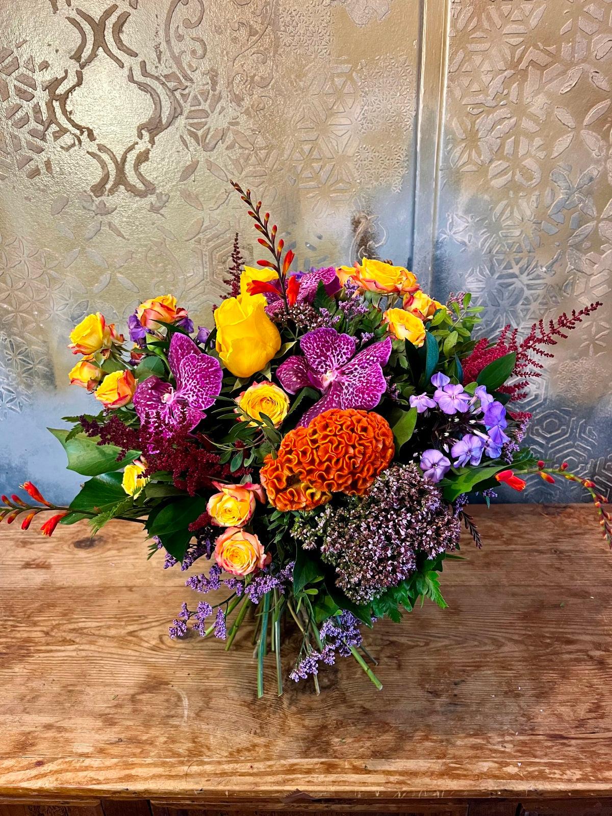 A colourful bouquet of seasonal blooms and foliage.