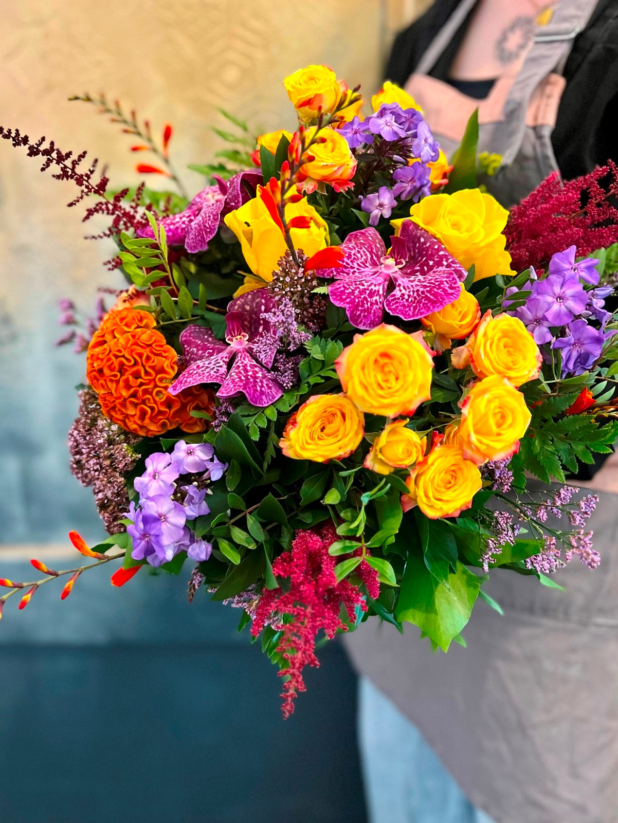 A colourful bouquet of seasonal blooms and foliage.