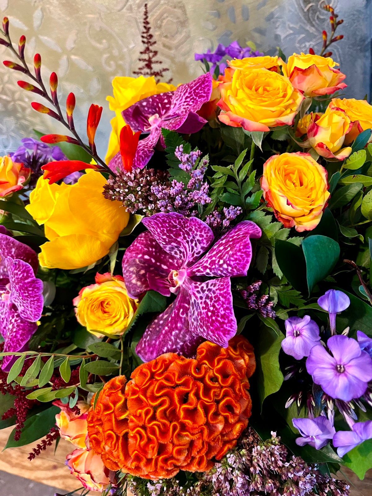 A colourful bouquet of seasonal blooms and foliage.