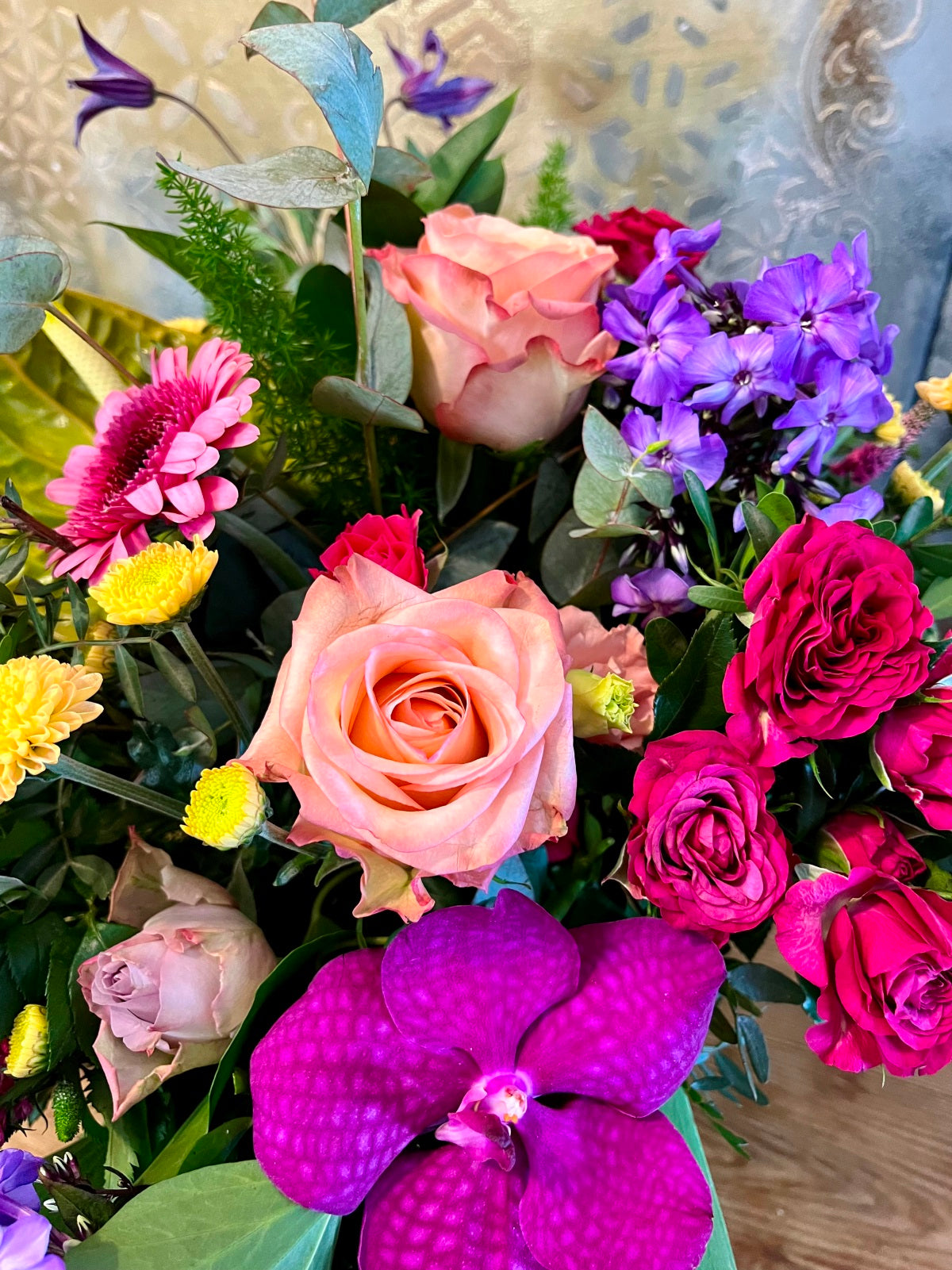 A pretty hand tied flower bouquet in shades of pinks.