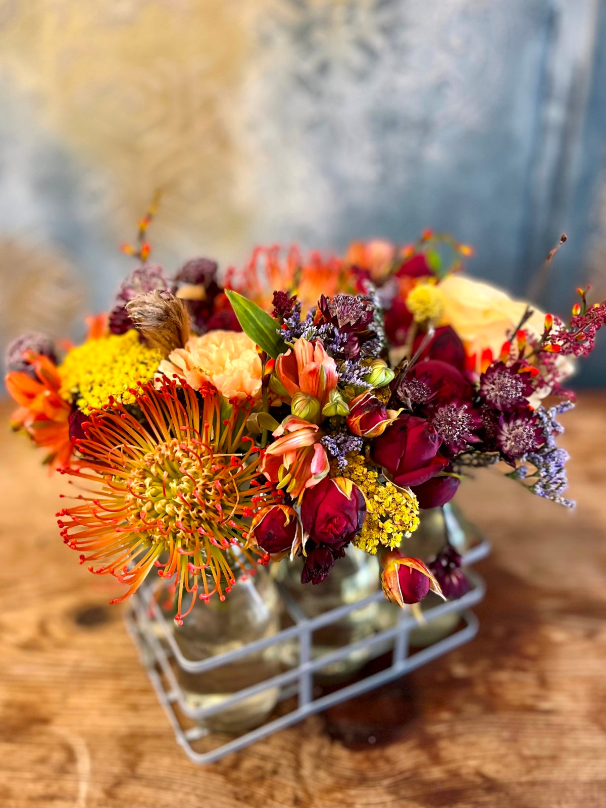 Autumn flowers in mini milk bottle vases