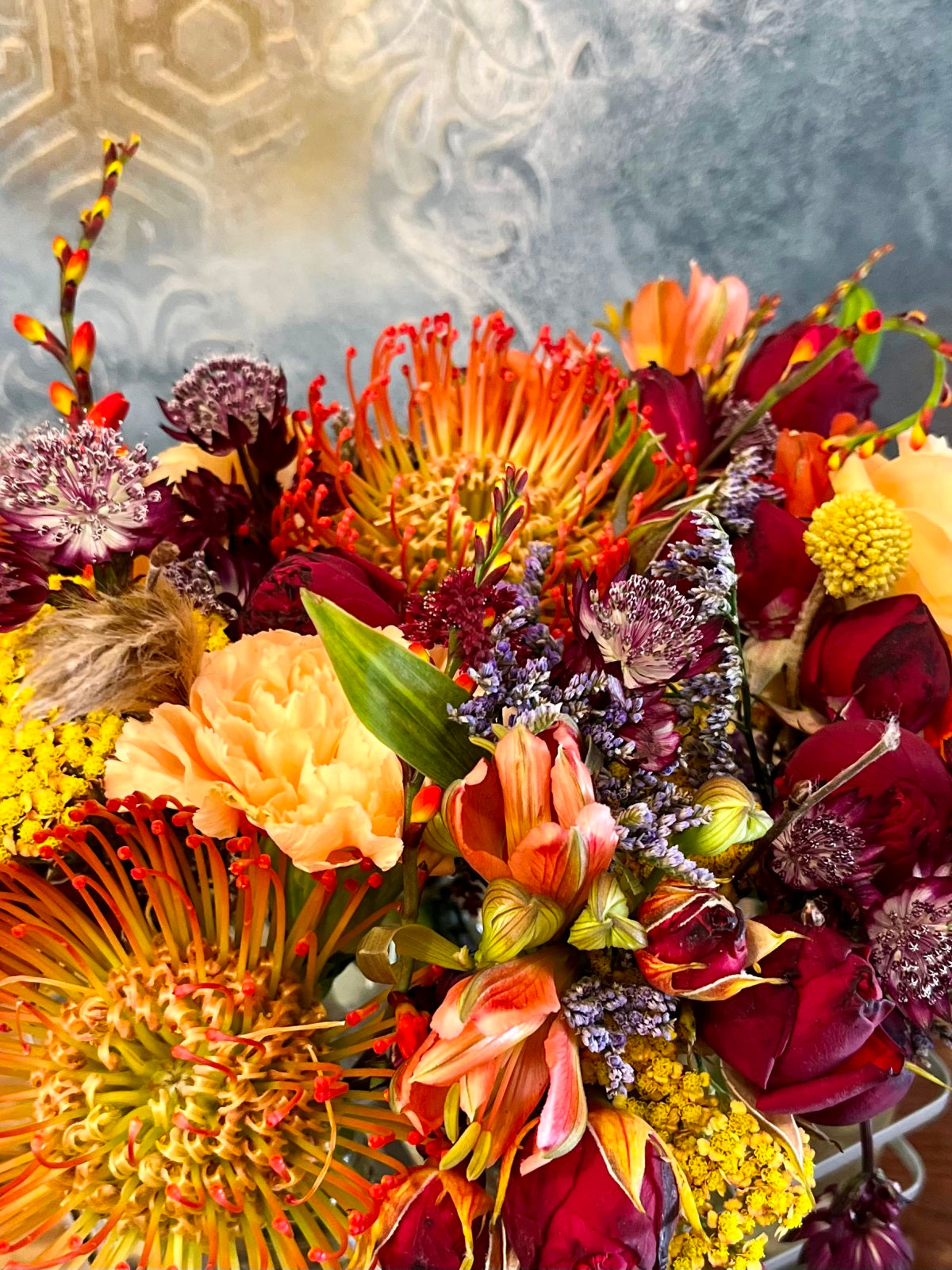 Autumn flowers in mini milk bottle vases