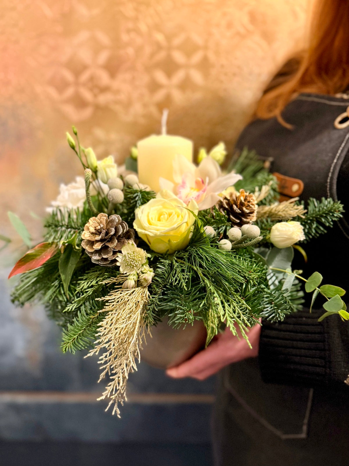 Christmas Candle White Flower Arrangement in Ceramic Container held