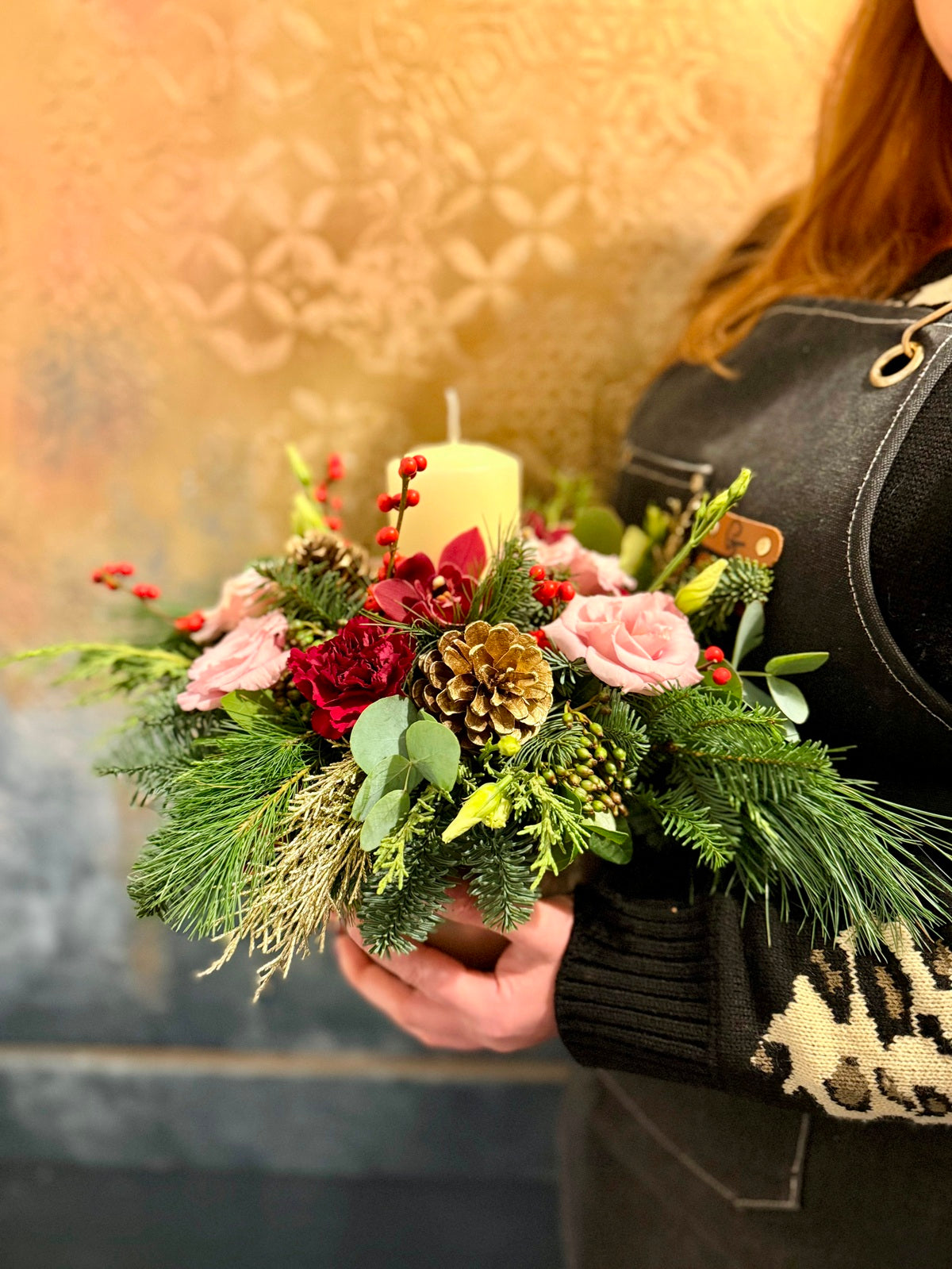 Christmas Candle Red and Pink Flower Arrangement in Ceramic Container held